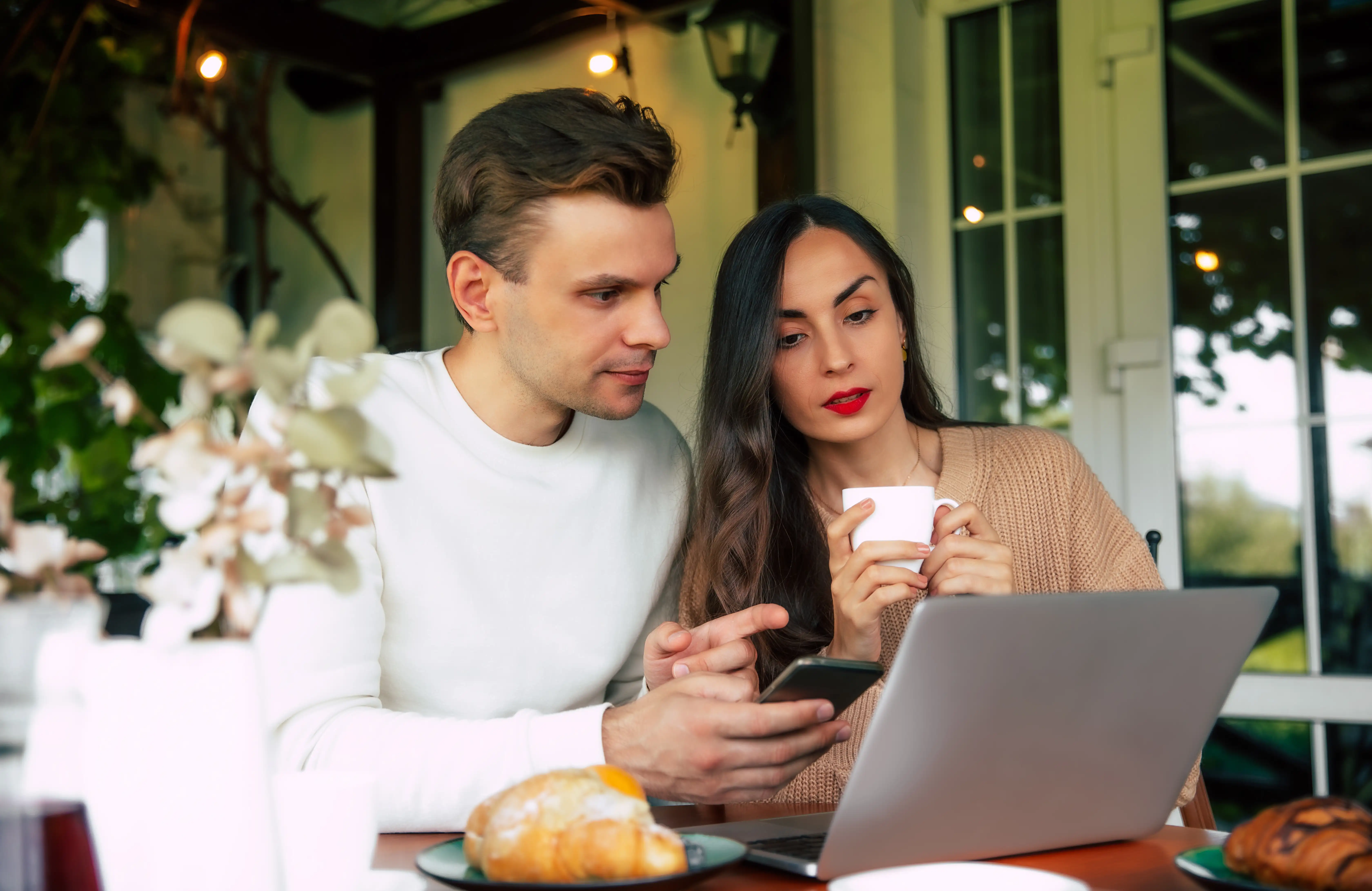 Couple reviewing finances together on a laptop